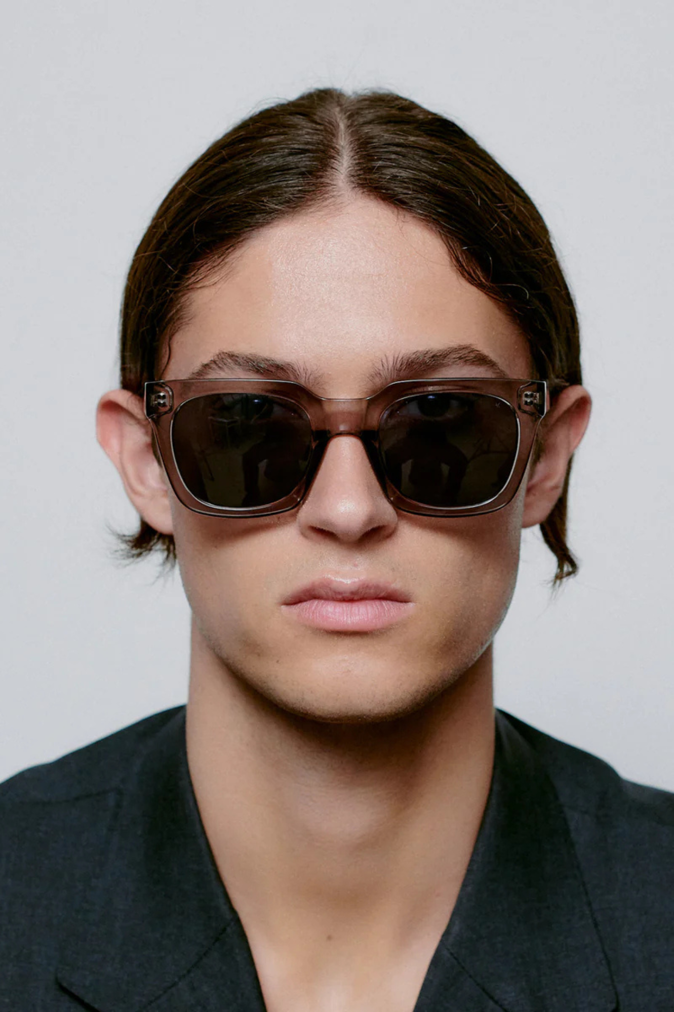 Model wearing the A. Kjaerbede nancy sunglasses in grey transparent. Front view