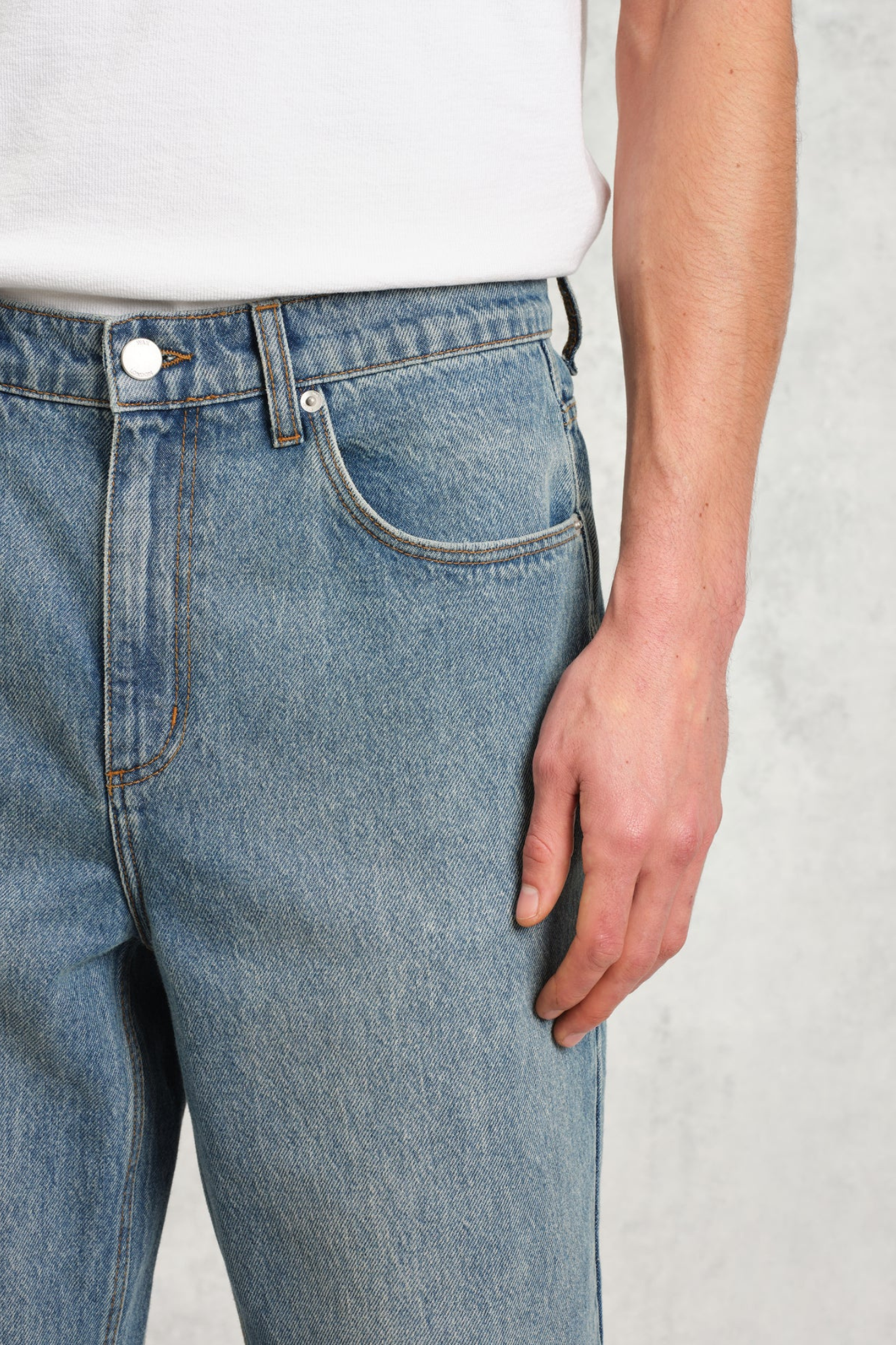 Model wearing the Wax London russel straight fit vintage denim jeans in vintage blue. Close front view