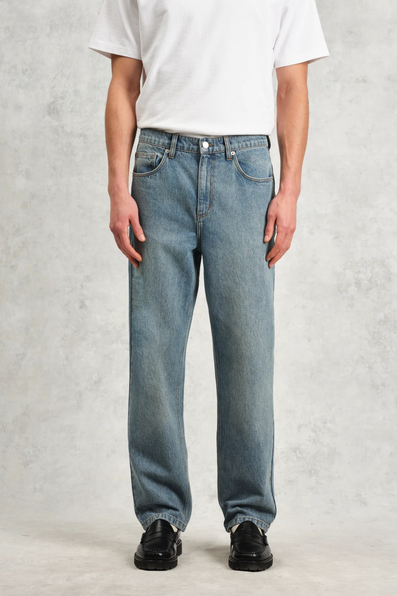 Model wearing the Wax London russel straight fit vintage denim jeans in vintage blue. Front view