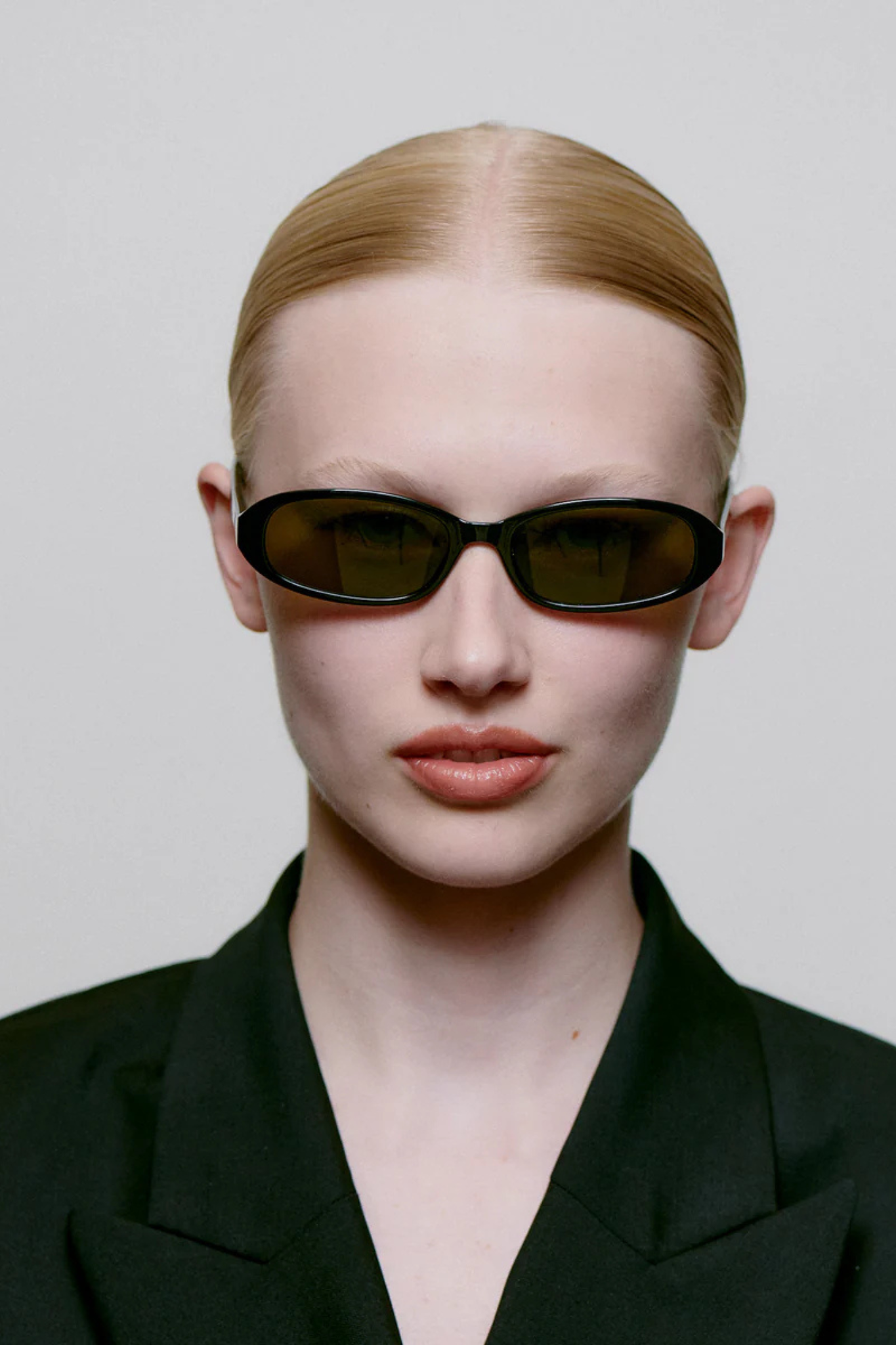 Model wearing the A. Kjaerbede macy sunglasses in black. Front view