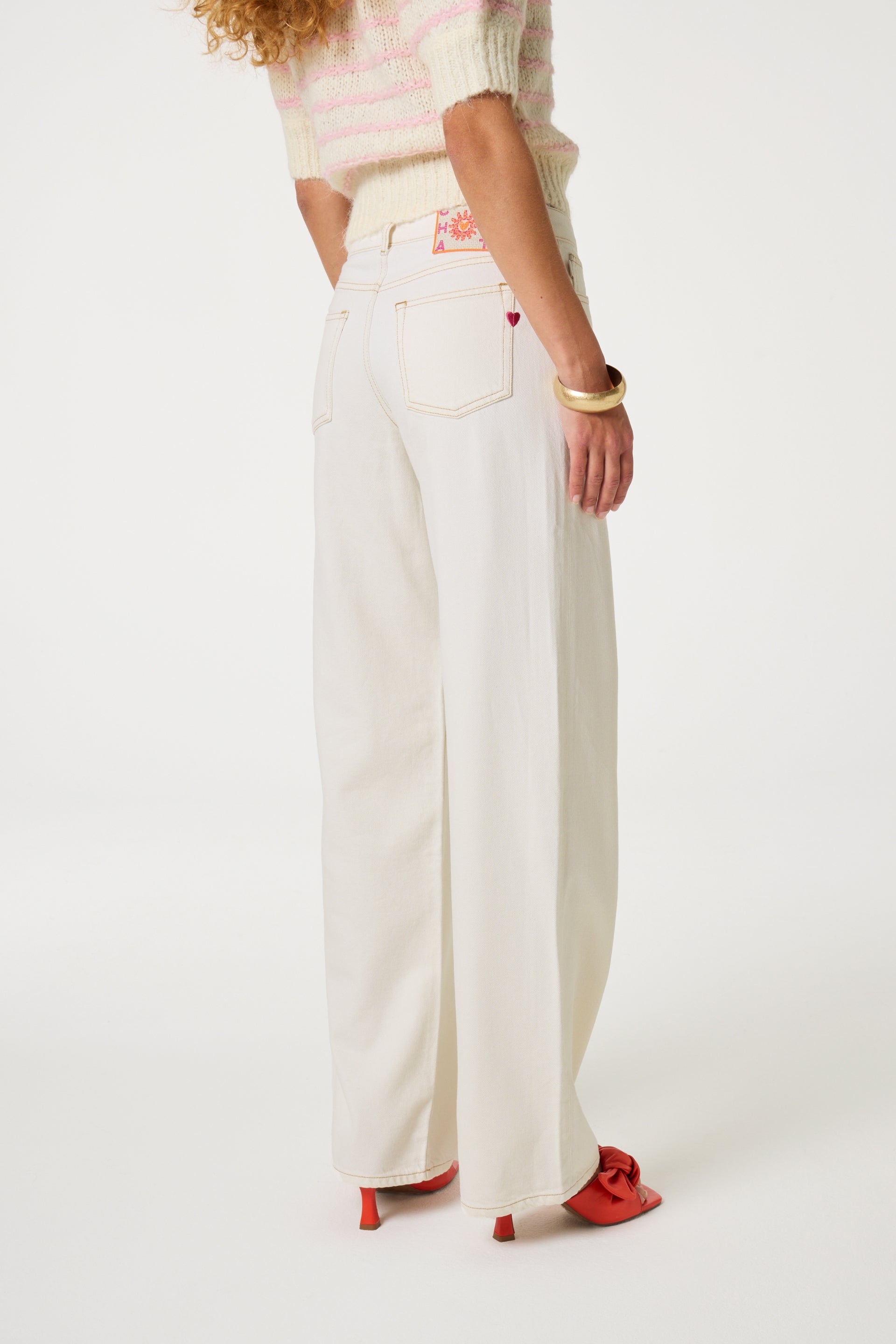 Model wearing the Fabienne Chapot lucy wide leg jeans in whit. Back view