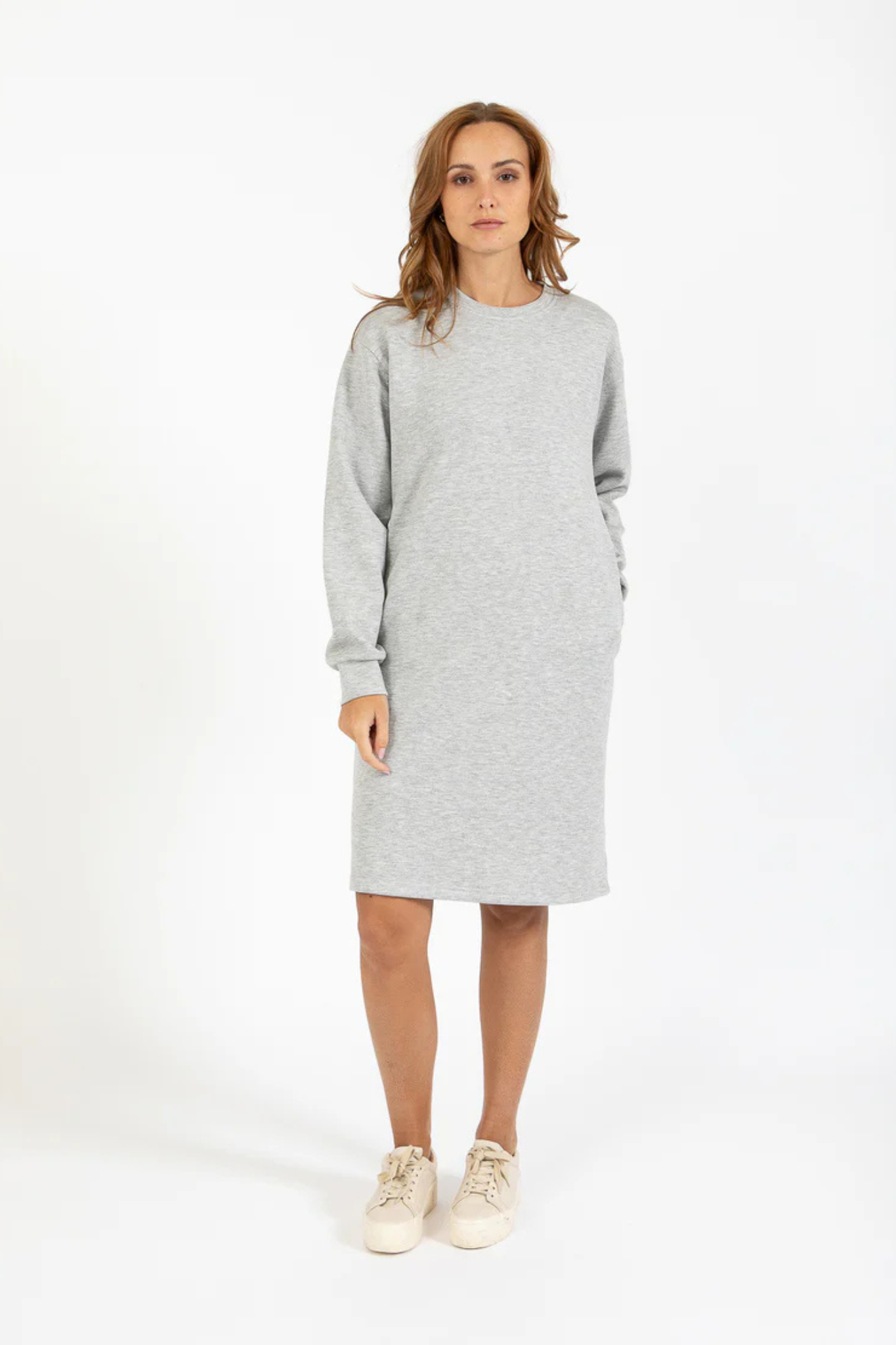 Model wearing the CC Heart Billie sweat dress in light grey. Front view