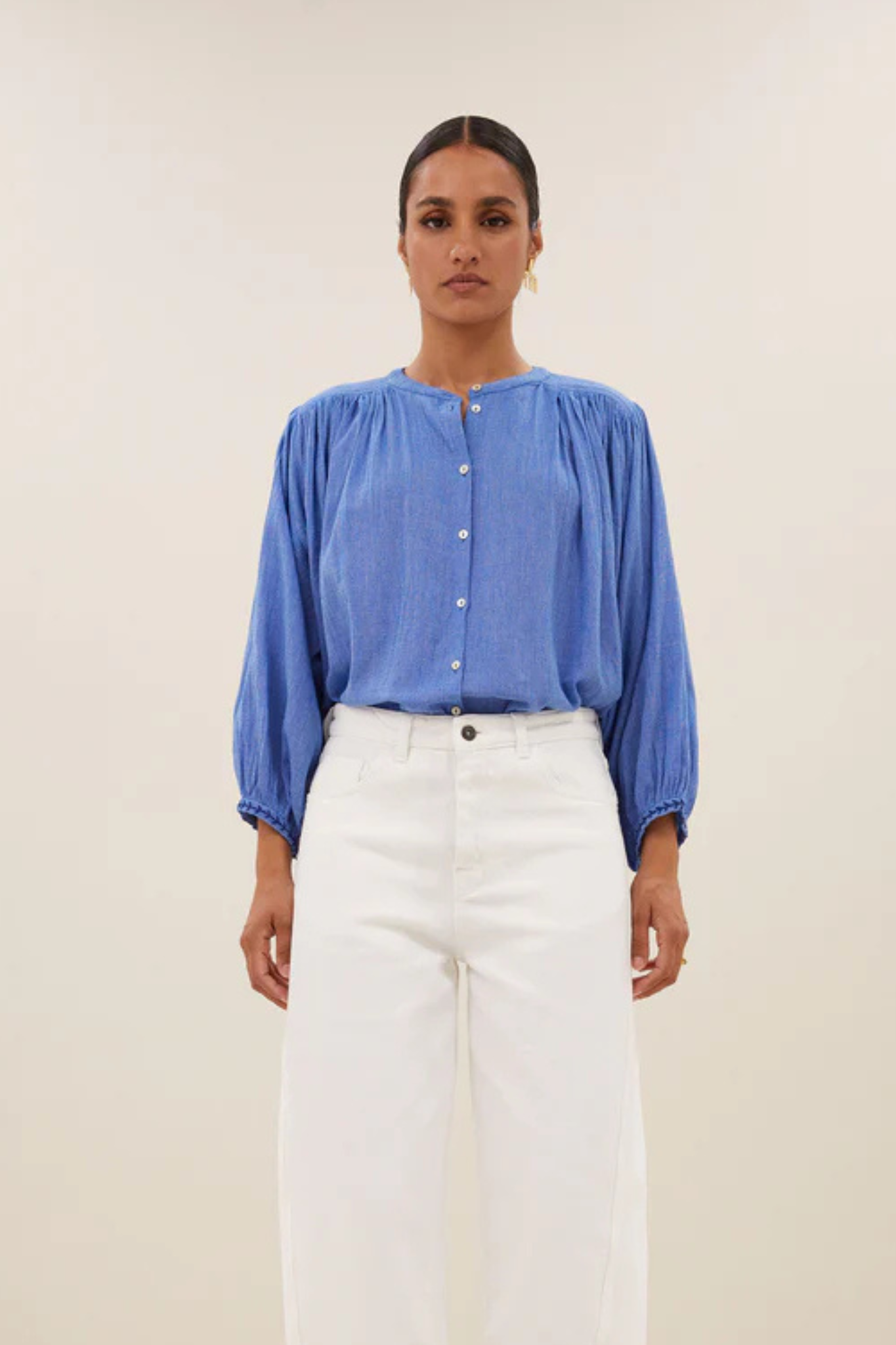 Model wearing the By-Bar becky athia blouse in sapphire blue. Front view