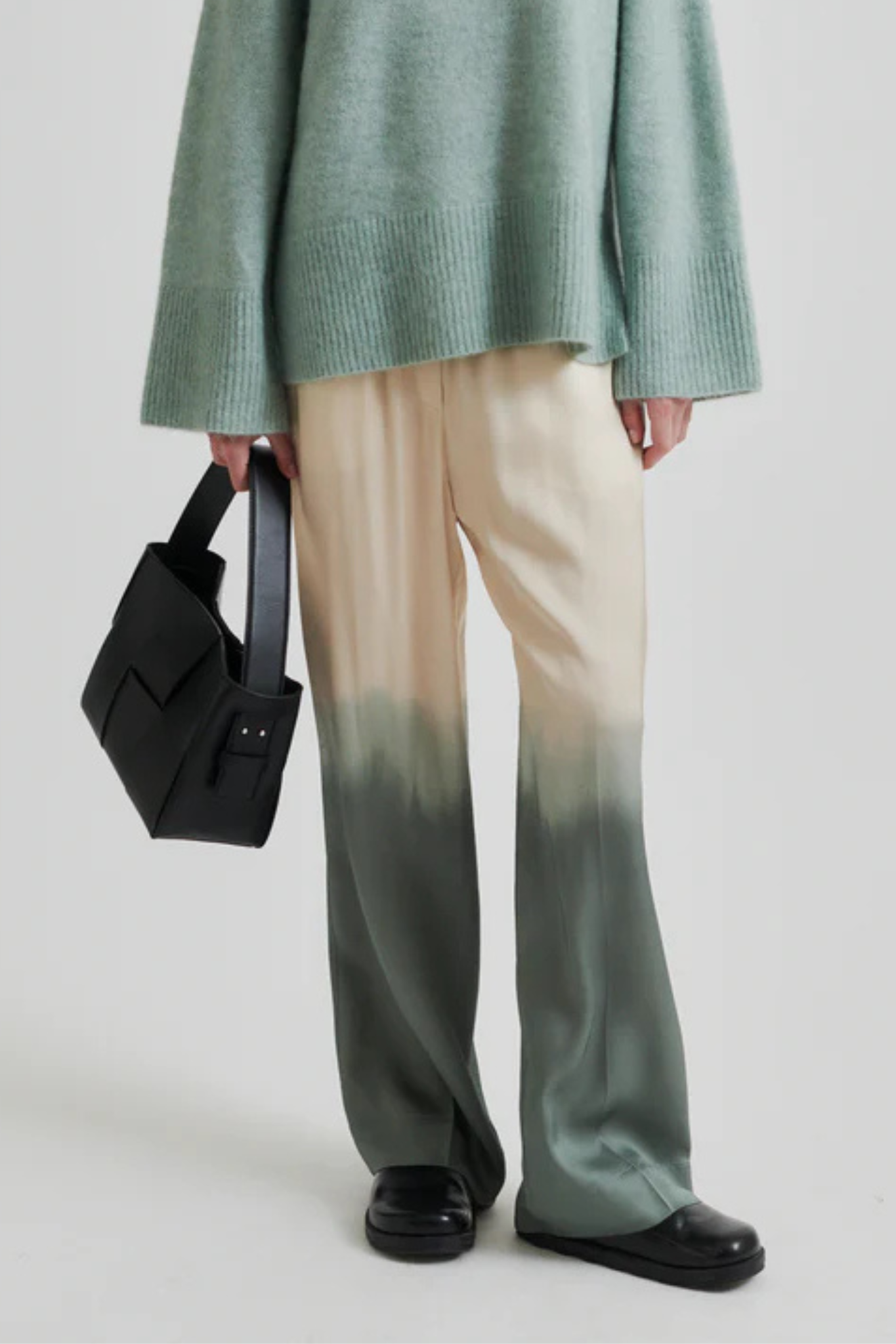 Model wearing the Second Female avora pants in beige and green. Front view