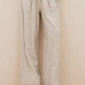 Model wearing the By-Bar Benji striped marine pants in beige and white. Front view