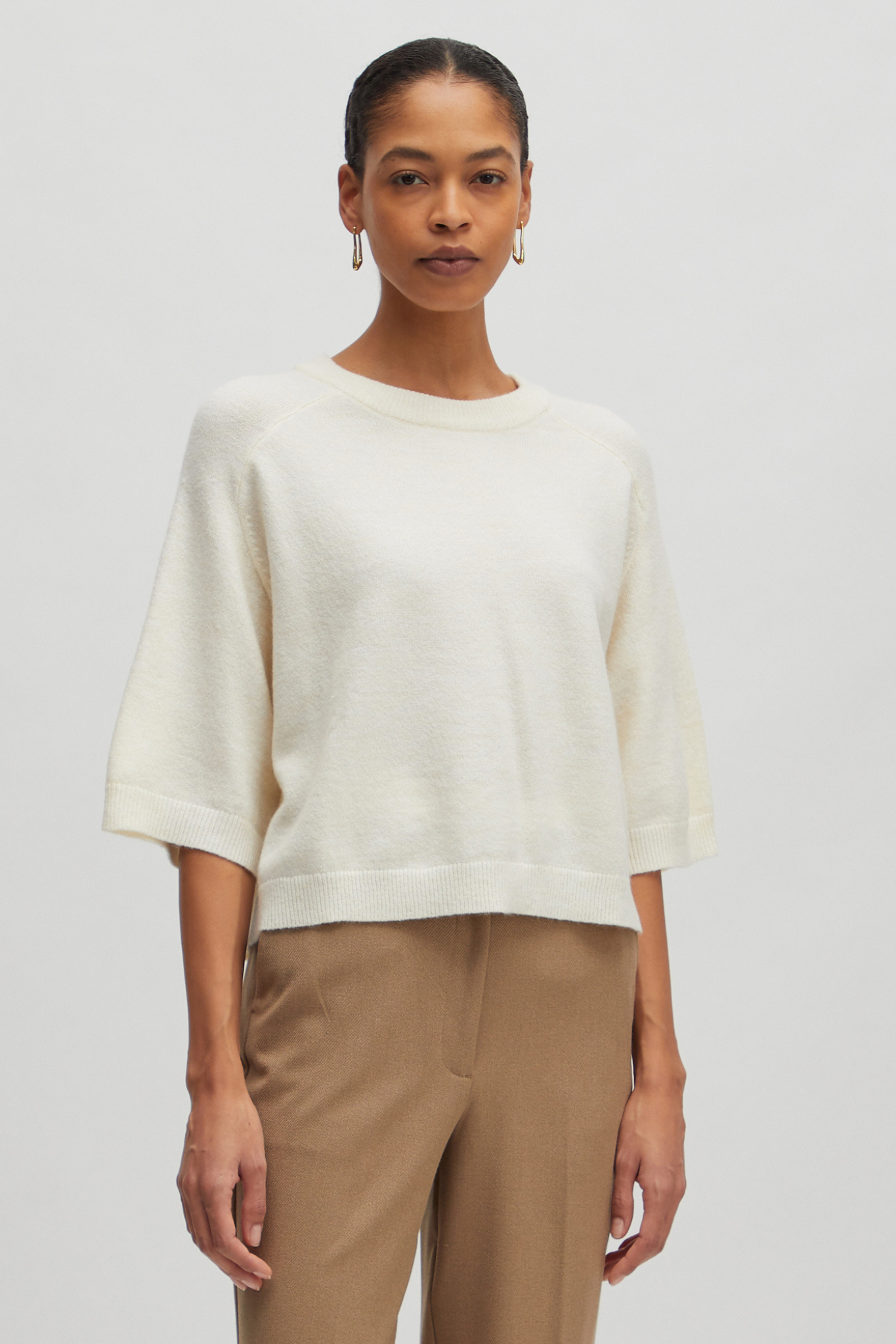 Model wearing the Edited birla knit in white. Front view