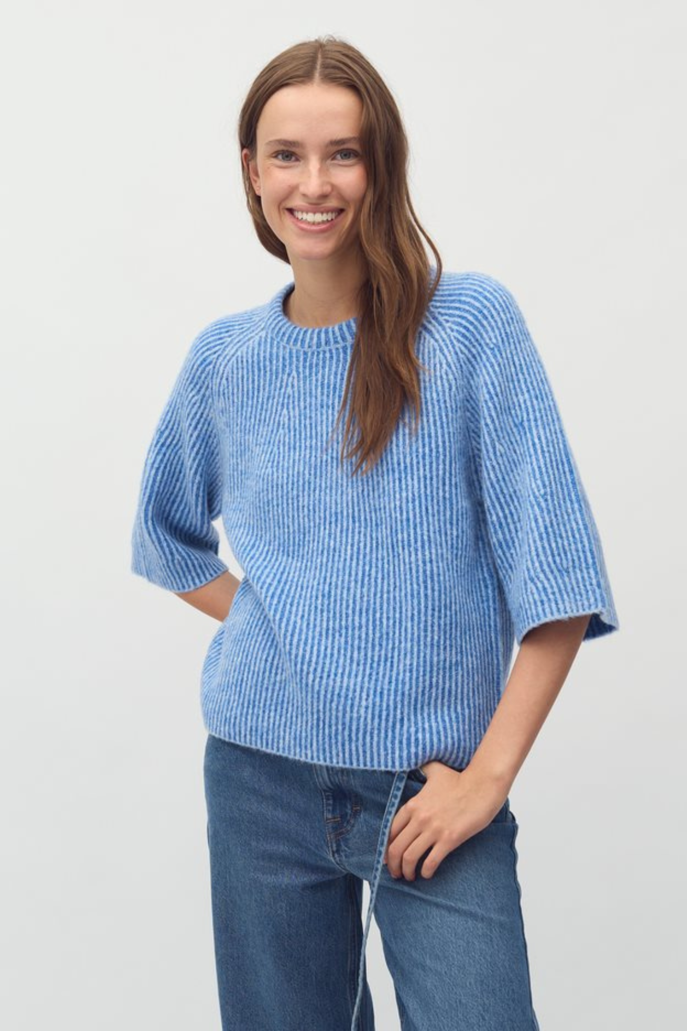 Model wearing the Mbym ubeda hevelyn knit in blue. Front view