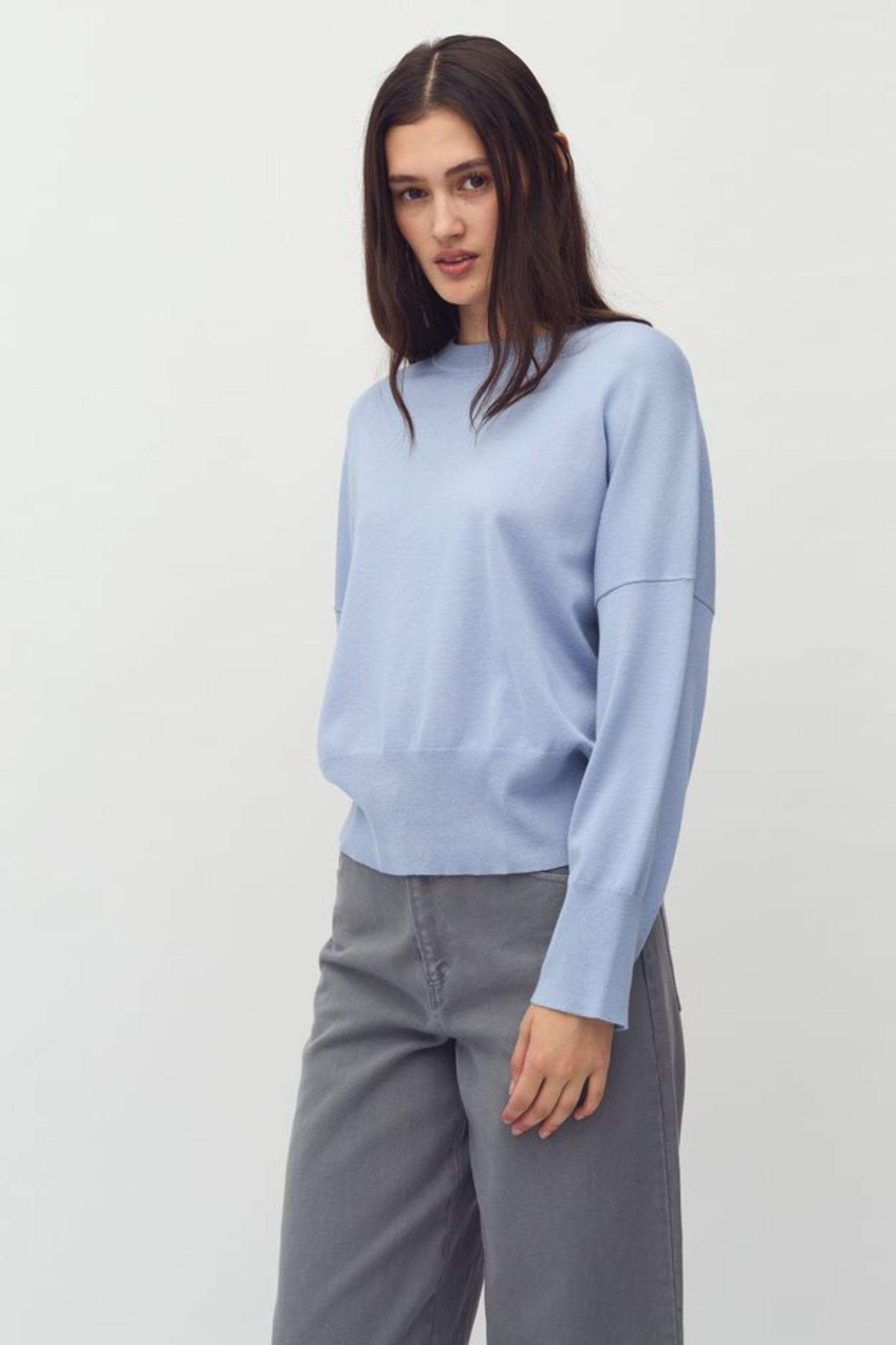 Model wearing the MBYM bravani gillian knit in steel blue. Front view