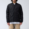 Model wearing the New Amsterdam quilted padded jacket in black. Front view