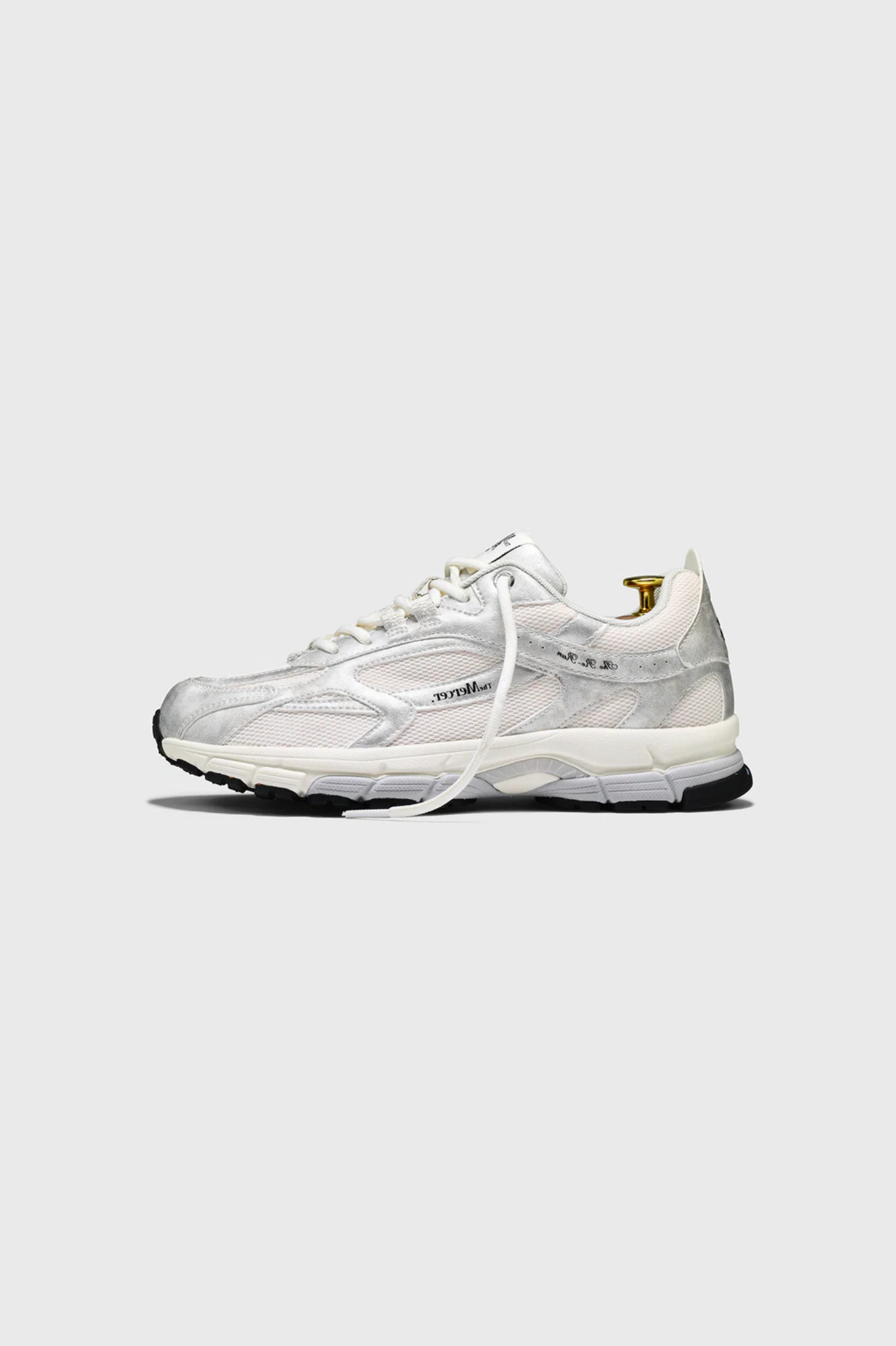 Mercer re-run metallic sneakers in silver. Side view