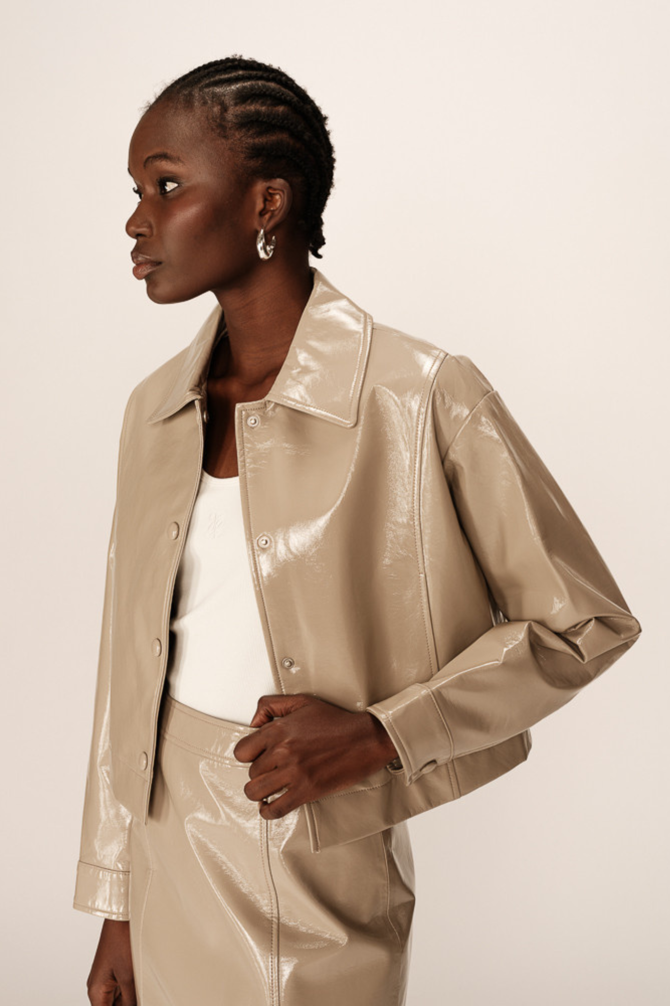 Model wearing the Grace & Mila poudre jacket in beige. Front view