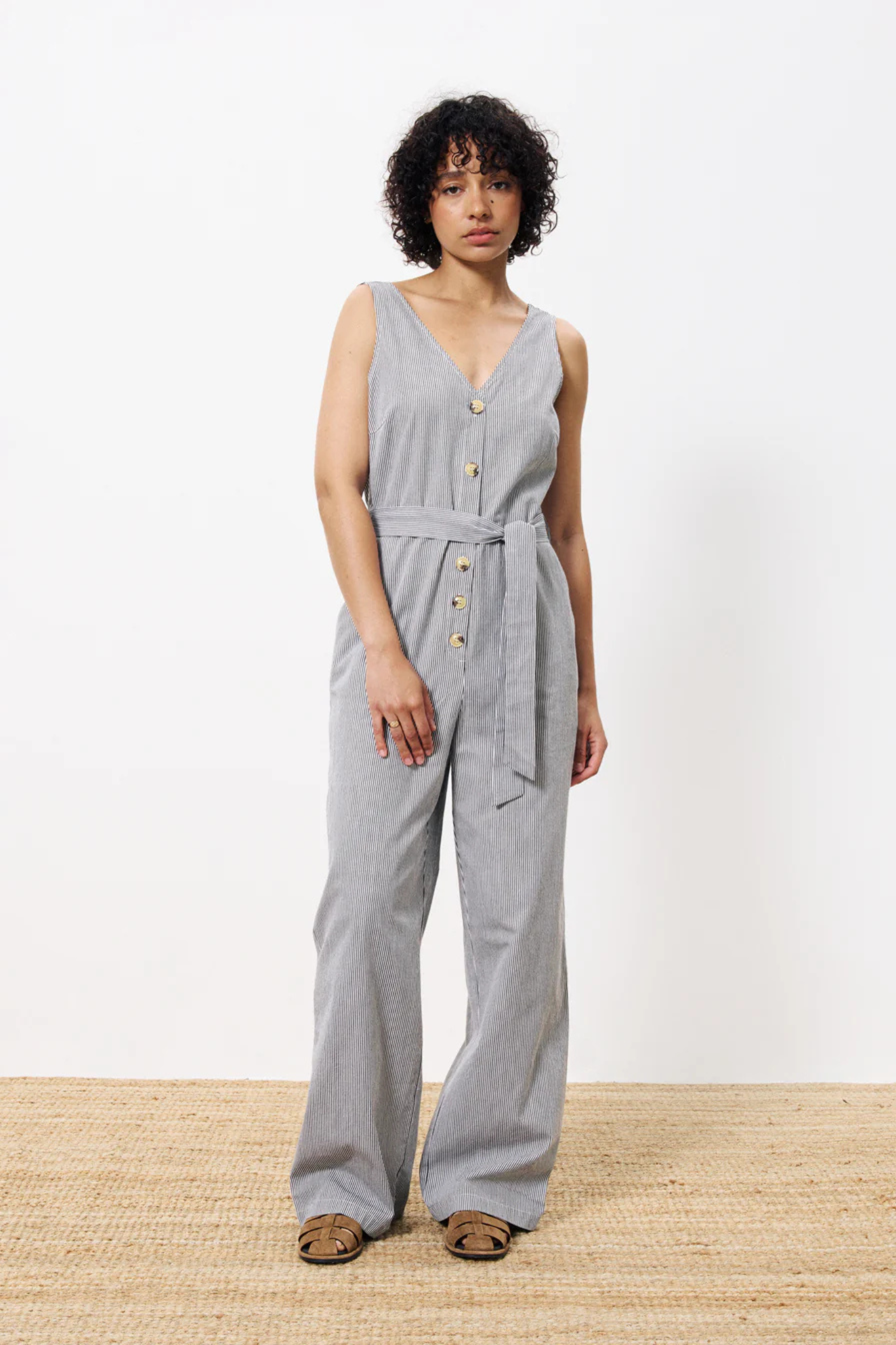 Model wearing the FRNCH maddie jumpsuit in creme. Front view