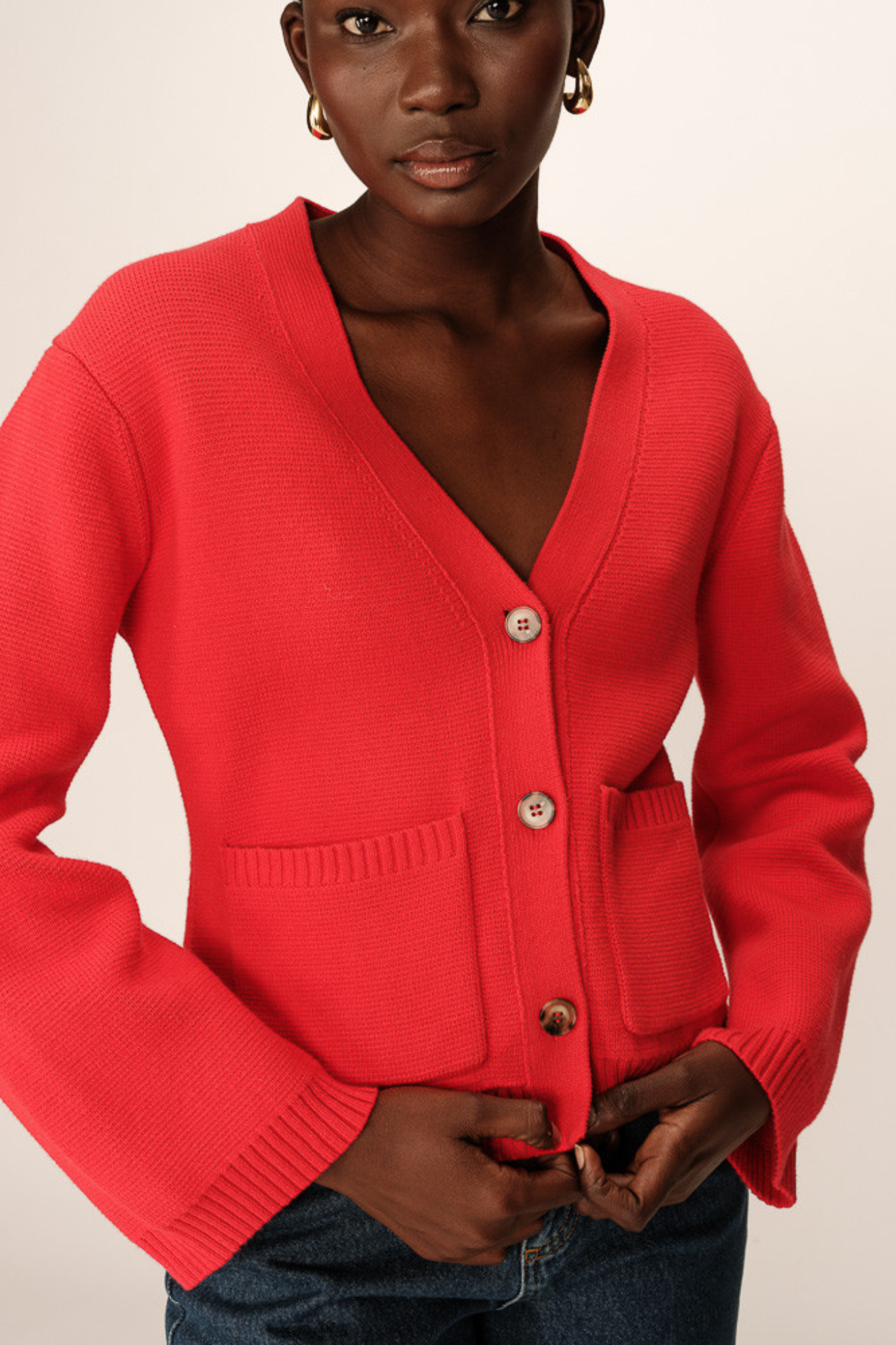 Model wearing the Grace & Mila paolino cardigan jacket in red. Front view