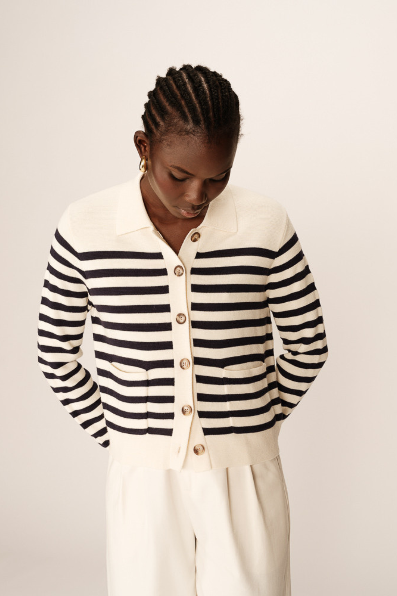 Model wearing the Grace & Mila pam cardigan in marine stripes in ecru and navy. Front view