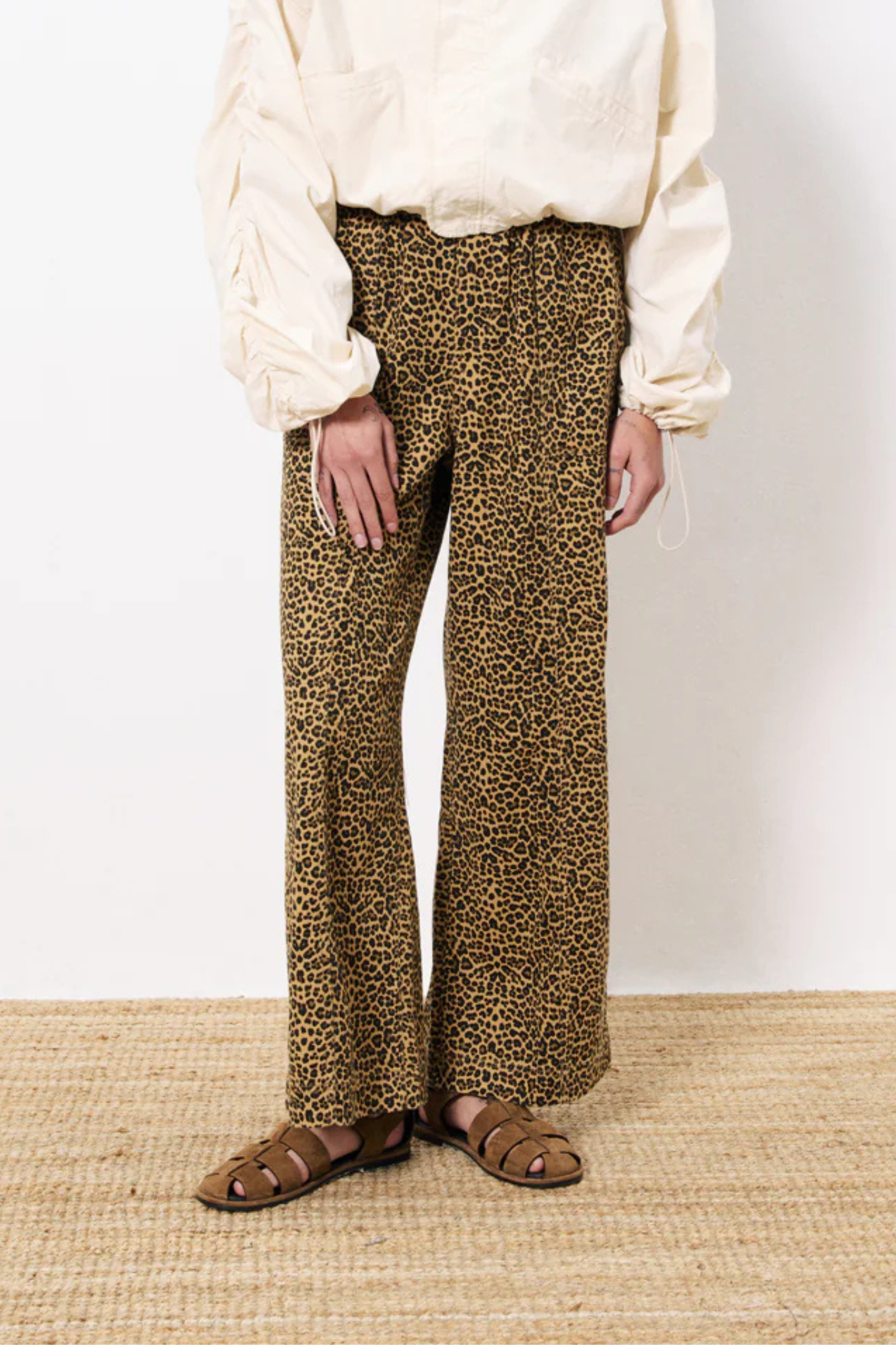 Model wearing the FRNCH cherin pants in leopard. Front view