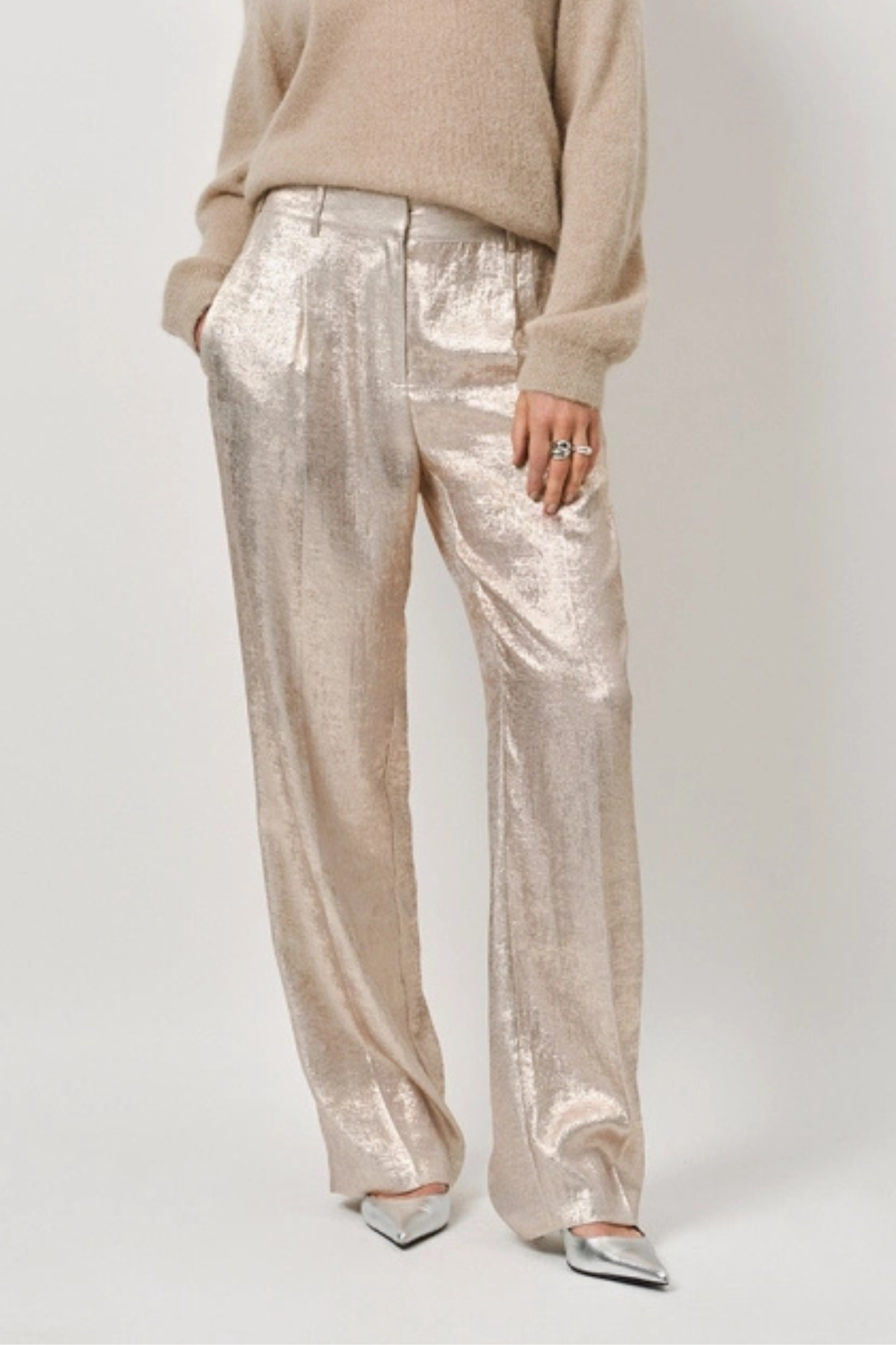 Model wearing the Dante6 Charm metallic pants in champagne. Front view