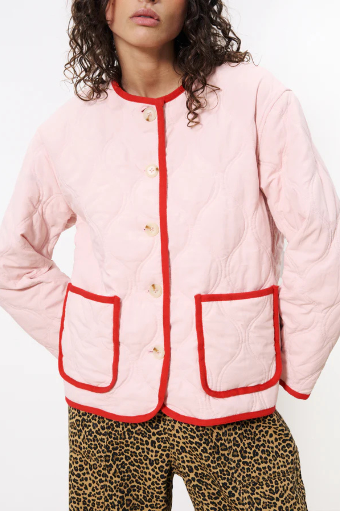 Model wearing the FRNCH alezia jacket in pink and red. Front view