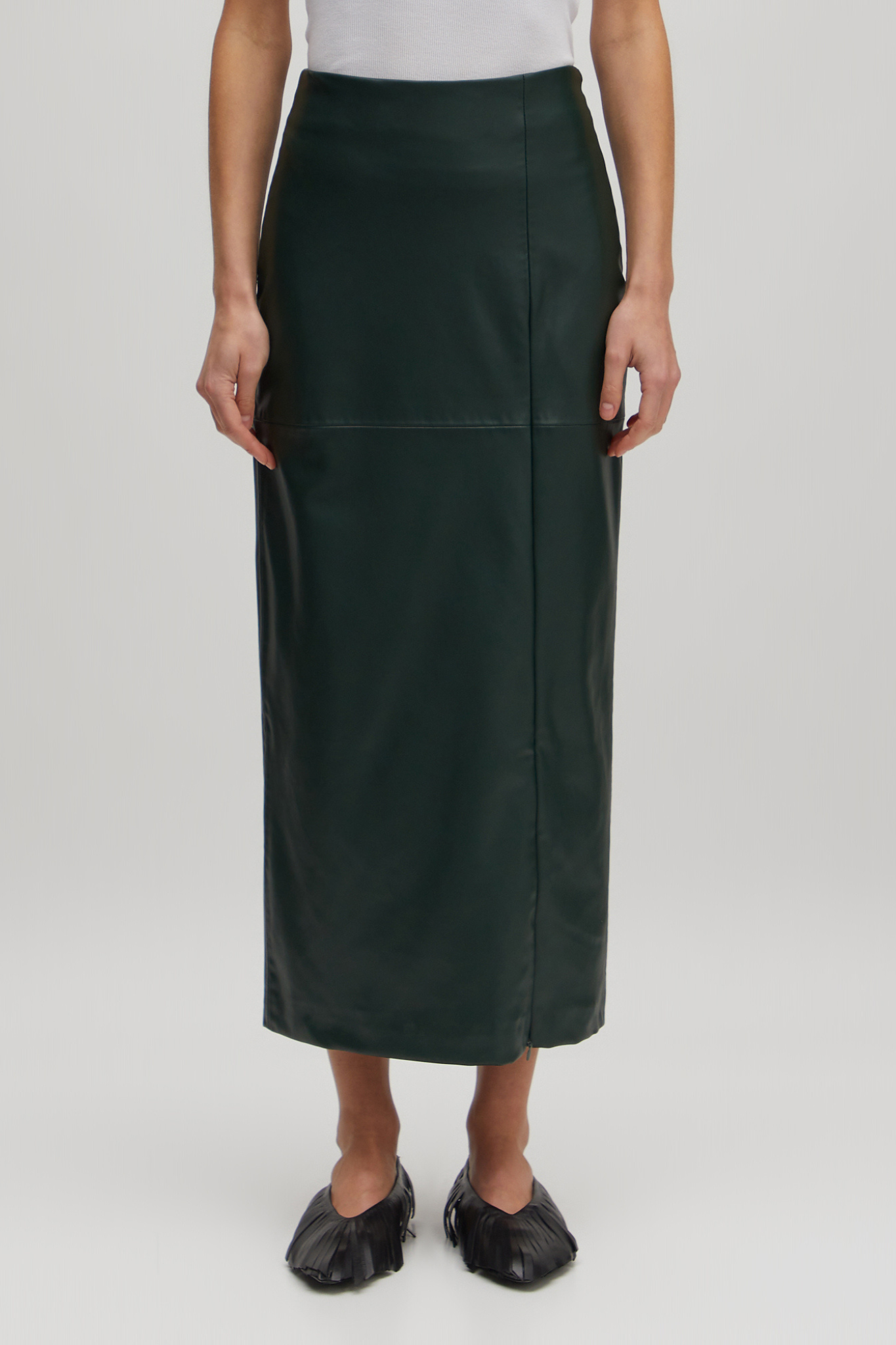 Model wearing the Edited Florin skirt in green. Front view