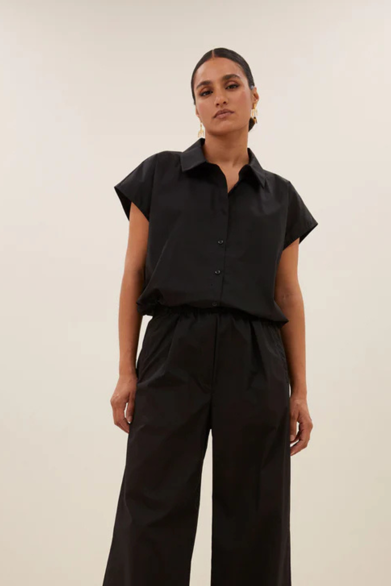 Model wearing the By-Bar bieke poplin blouse in black. Front view