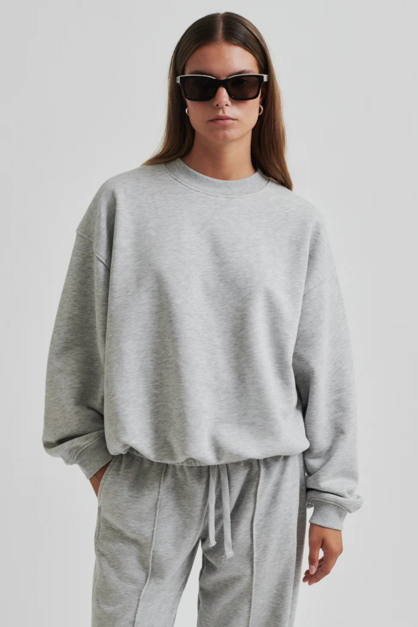 Model wearing the Second Female abadell ballon sweater in grey. Front view