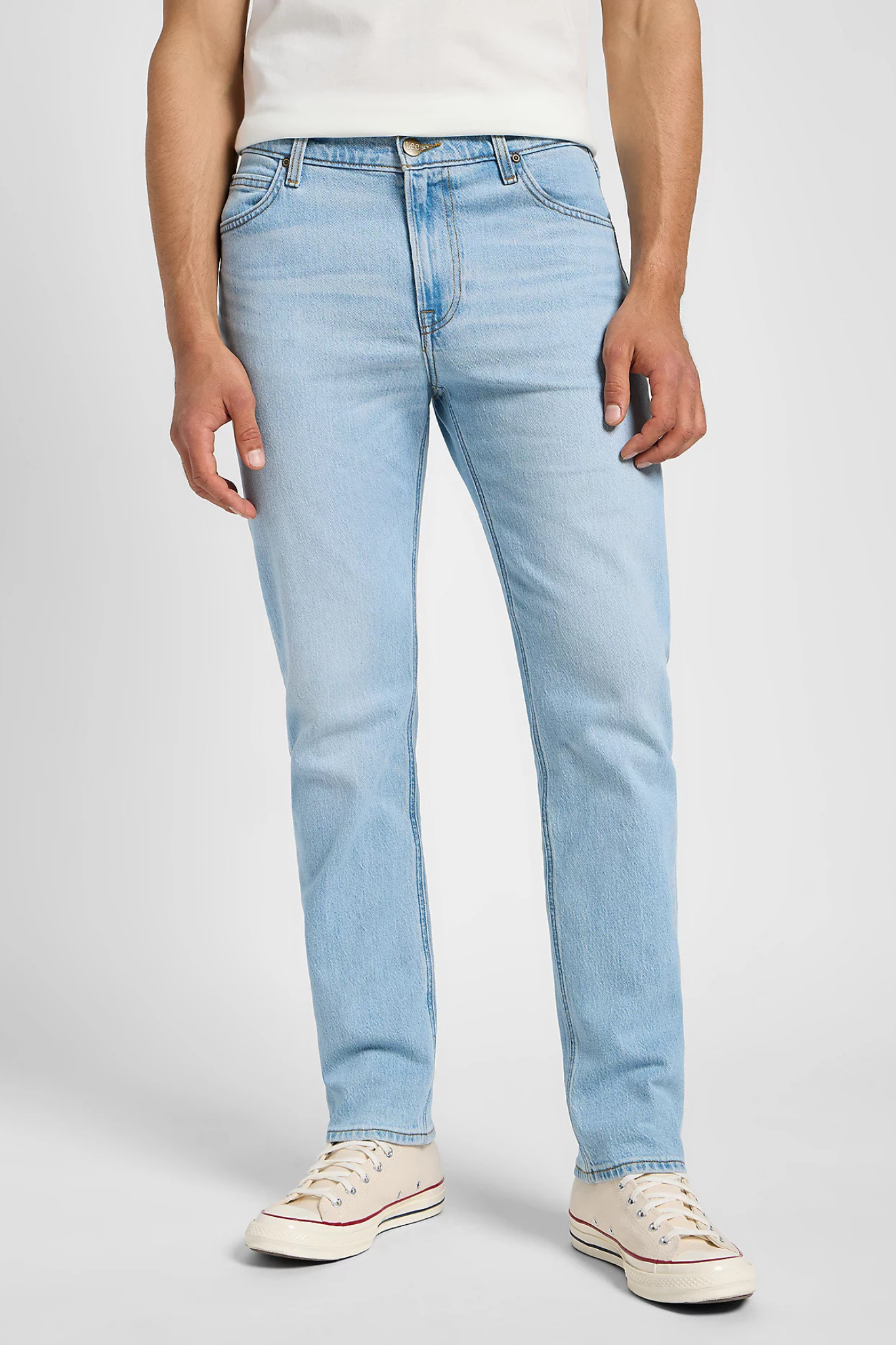 Model wearing the Lee west jeans in light blue. Front view