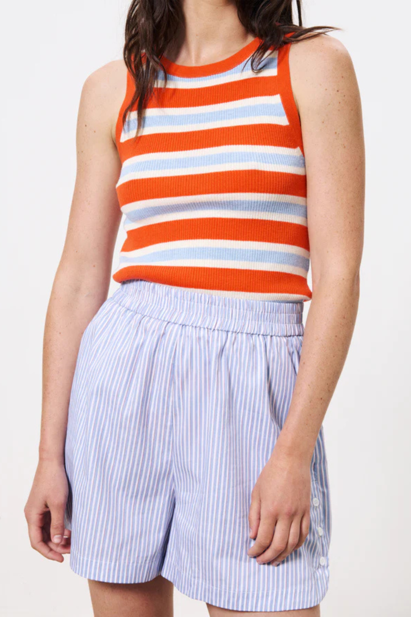 Model wearing the FRNCH syana short in blue and white striped. Front view