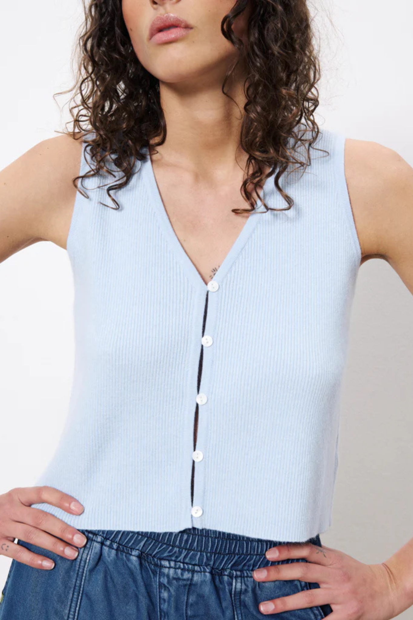 Model wearing the FRNCH maurane top in light blue. Front view