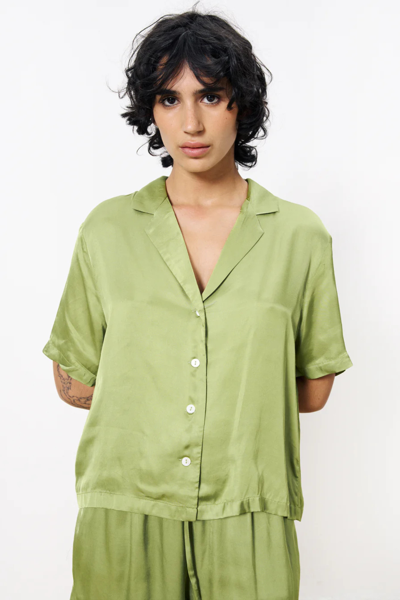 Model wearing the FRNCH chelly shirt in green. Front view