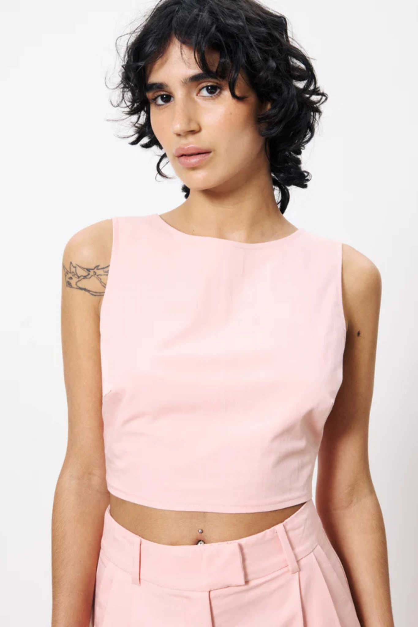 Model wearing the FRNCH lola top in pink. Front view