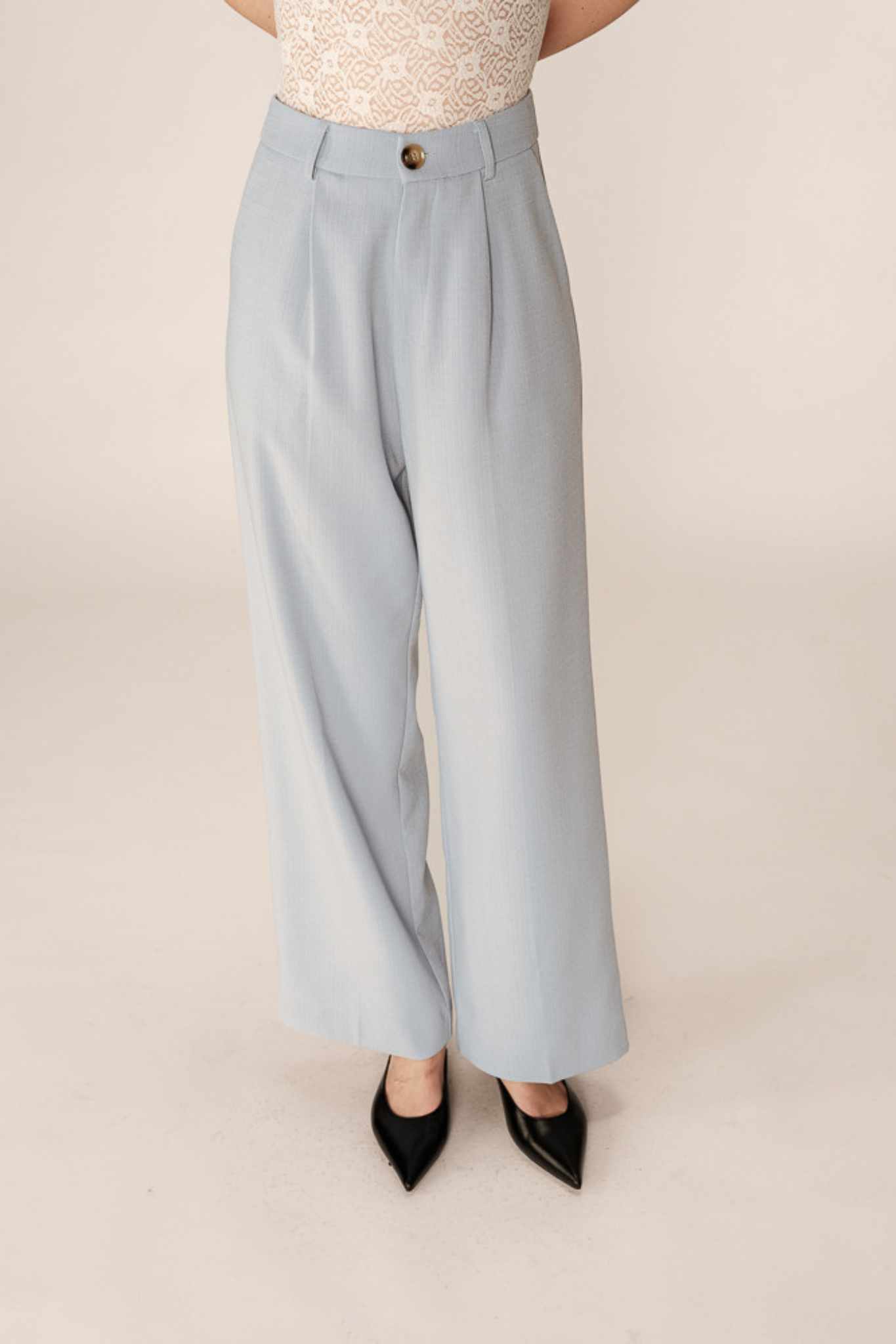 Model wearing the Grace & Mila pierre pants in light blue. Front view