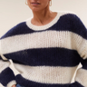 Model wearing the By-Bar Evi striped pullover in white and blue. Front view