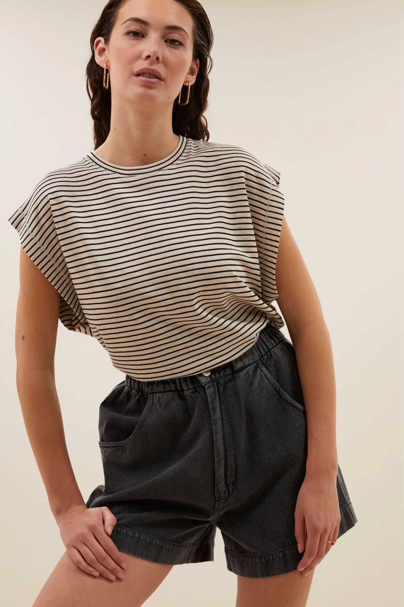 Model wearing the By-Bar mason small stripe top in white and black striped. Front view