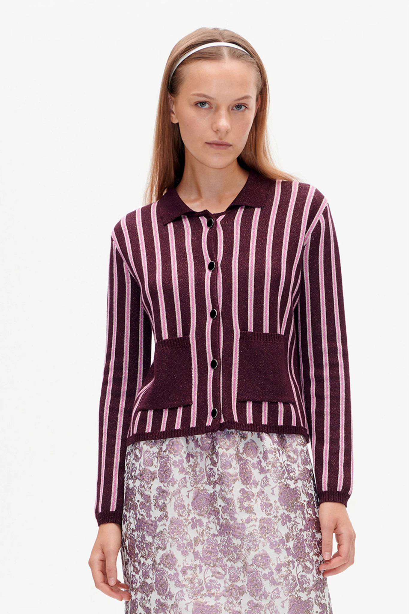 Model wearing the Baum Und Pferdgarten capera cardigan in purple and pink striped. Front view