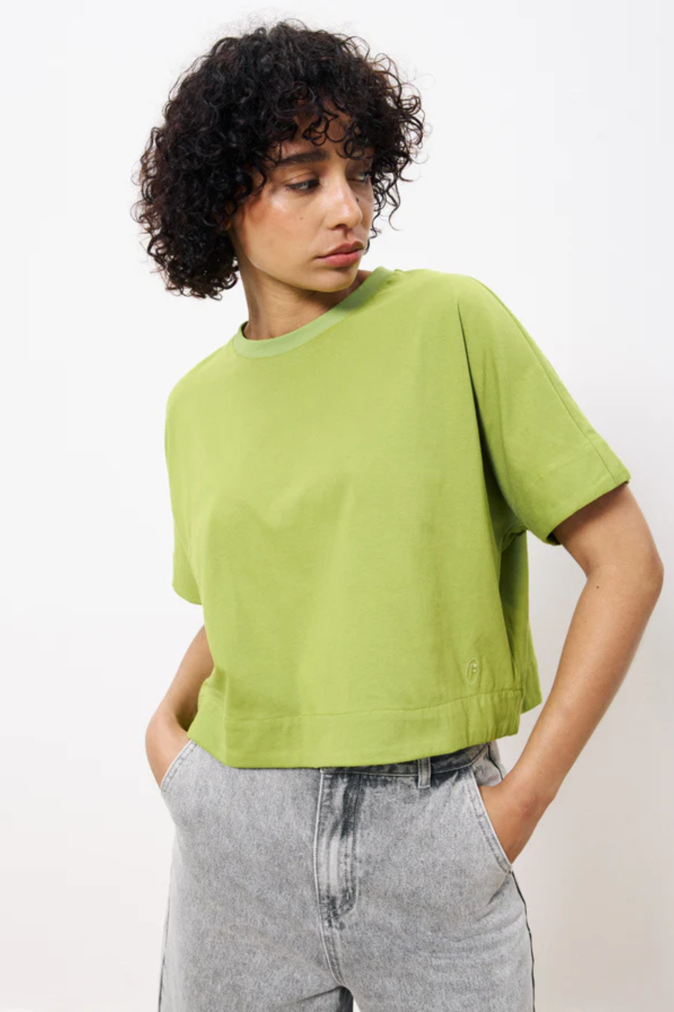 Model wearing the FRNCH shade top in green. Front view