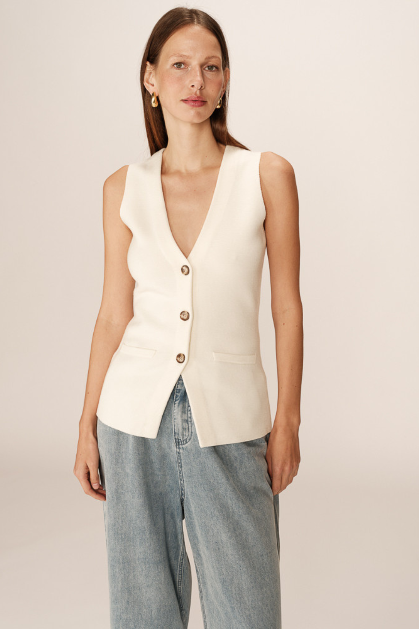 Model wearing the Grace & Milla panama waistcoat in ecru. Front view