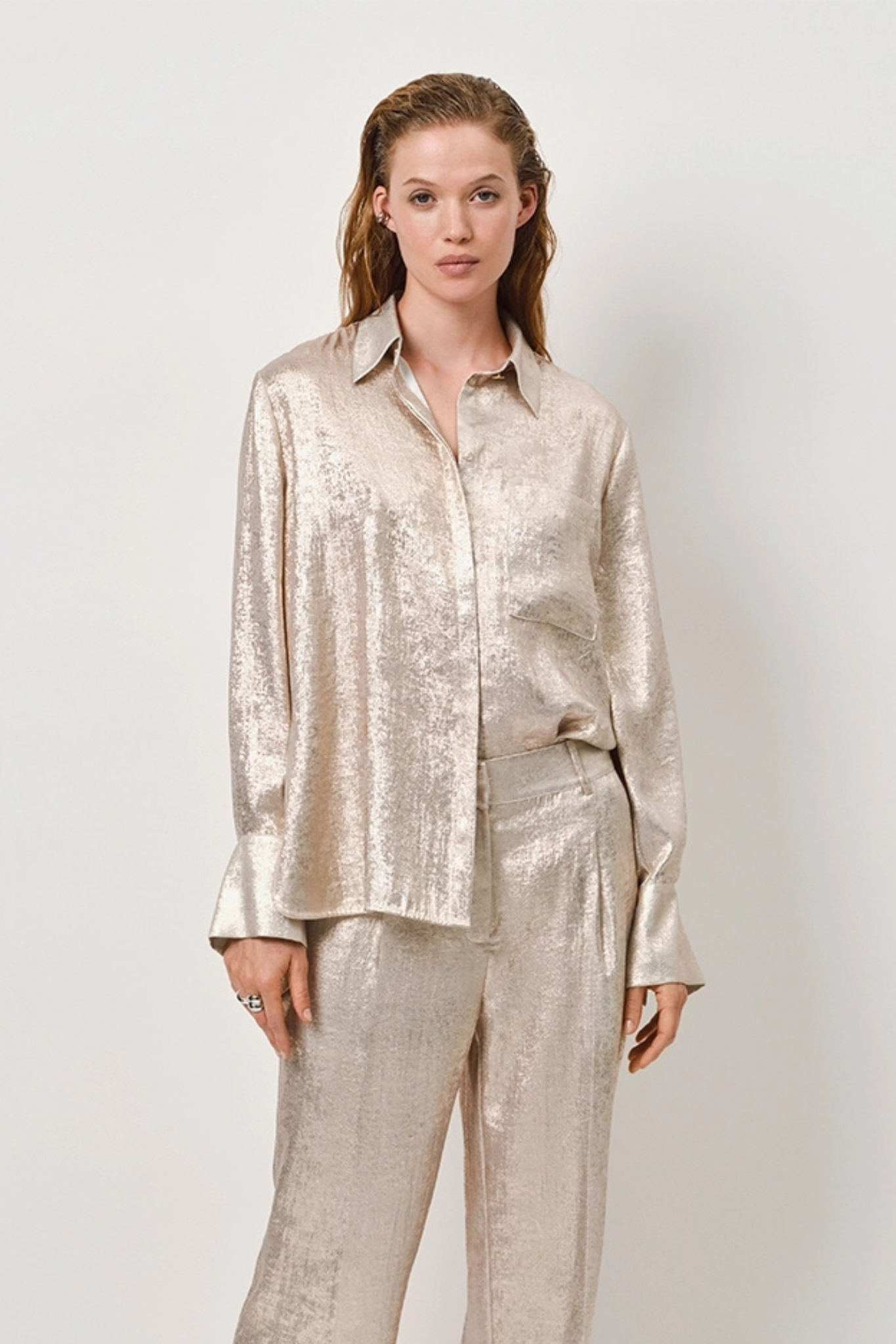 Model wearing the Dante6 Cathin metallic long shirt in champagne. Front view