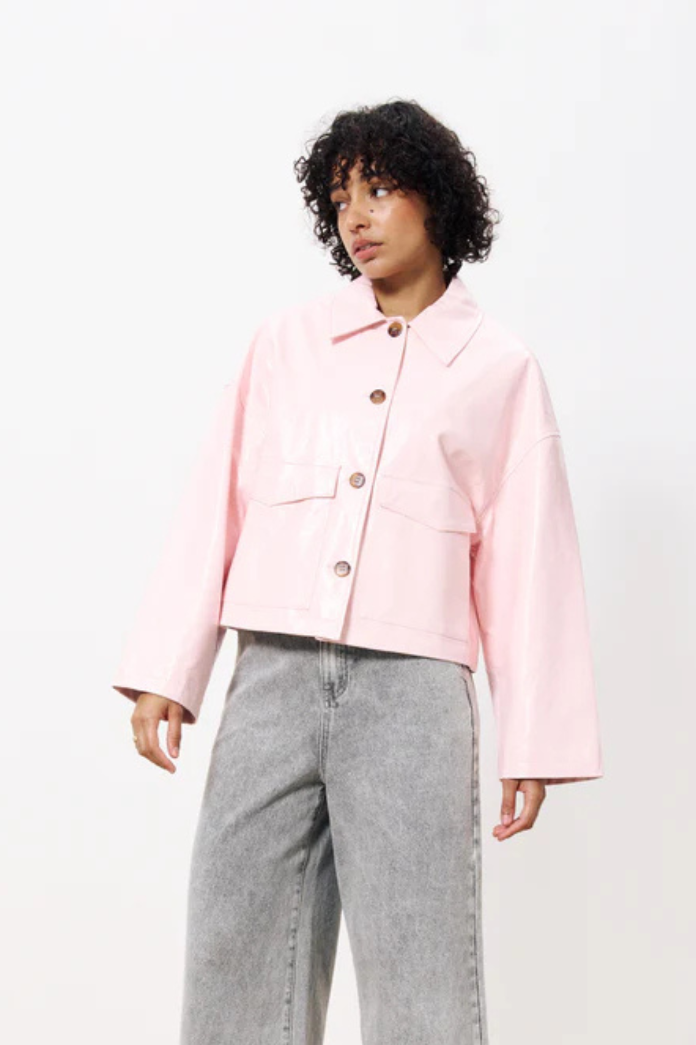 Model wearing the FRNCH carmelie jacket in rose pale. Front view