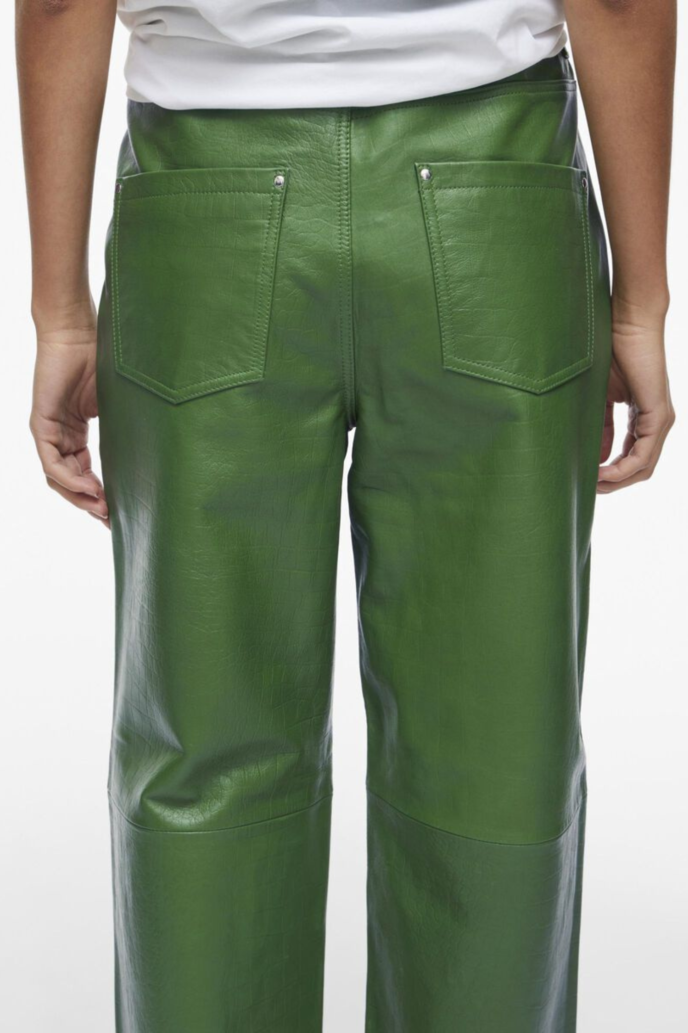 Model wearing the Rouge Edit artichoke green leather pants. Back view