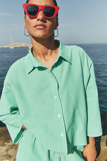 Model wearing the By-Bar bernie blouse in striped green. Front view