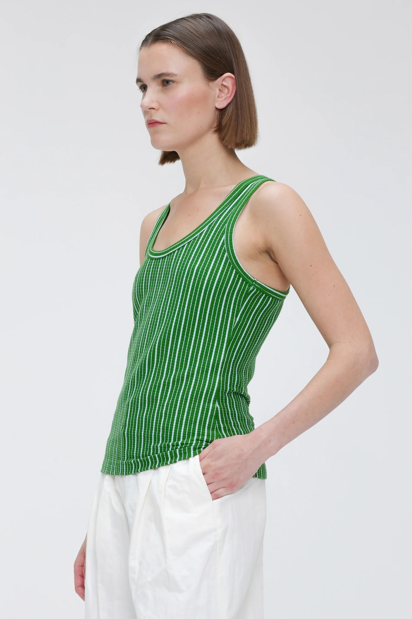 Model wearing the Our Sister kami top in green. Side view