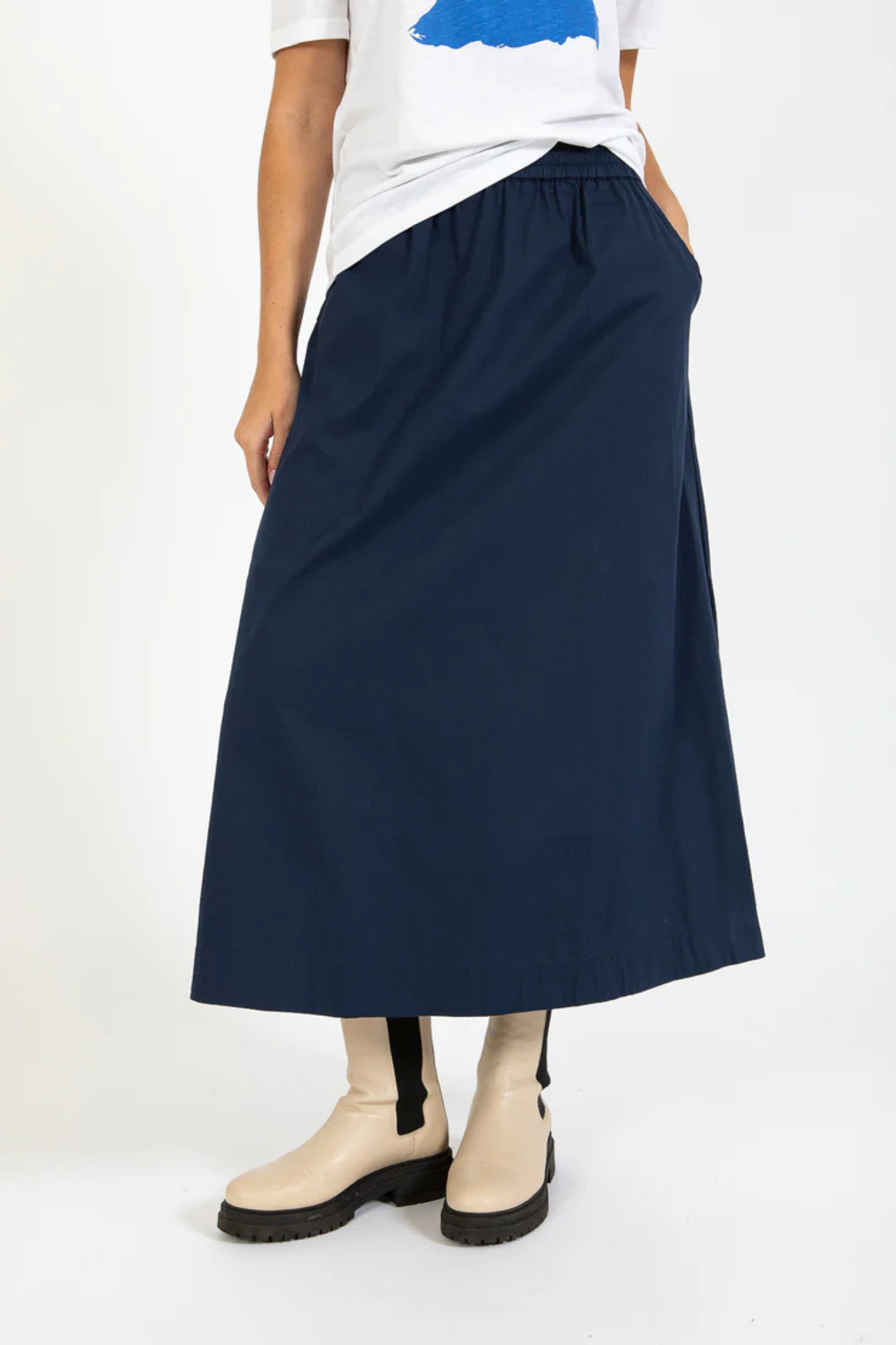 Model wearing the CC heart Phoebe long skirt in navy. Front view