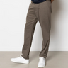 Model wearing the Clean Cut Copenhagen jersey pants in dark khaki. Front view