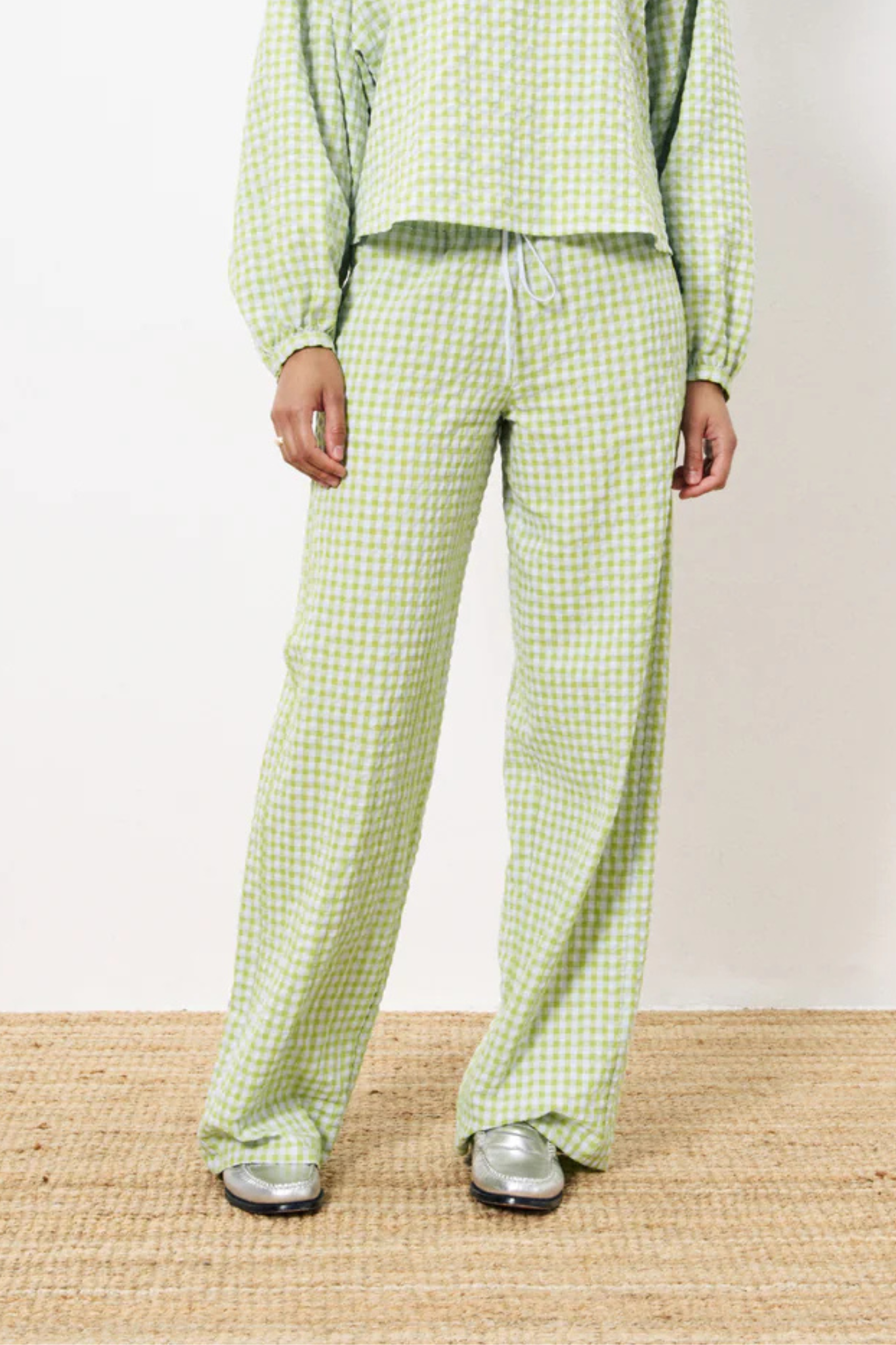 Model wearing the FRNCH ismery pants in green checked. Front view