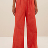 Model wearing the By-Bar Benji twill pants in poppy red. Front view