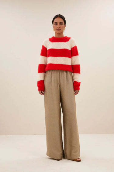 Model wearing the By-Bar Sian striped pullover in red and white. Front view