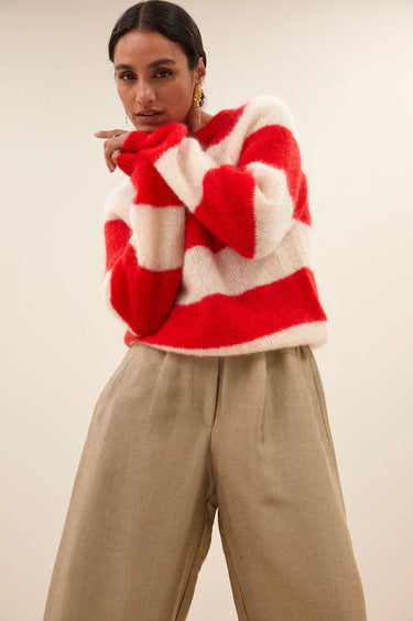 Model wearing the By-Bar Sian striped pullover in red and white. Front view