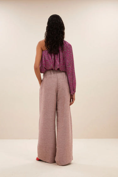 Model wearing the By-Bar Benji gloss pants in mellow rose. Back view