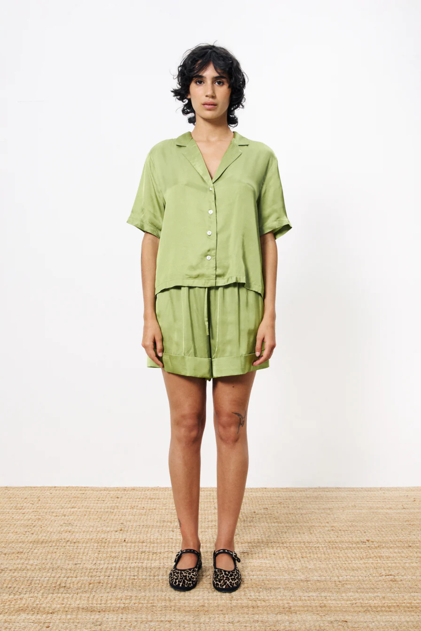 Model wearing the FRNCH noelle short in green. Front view