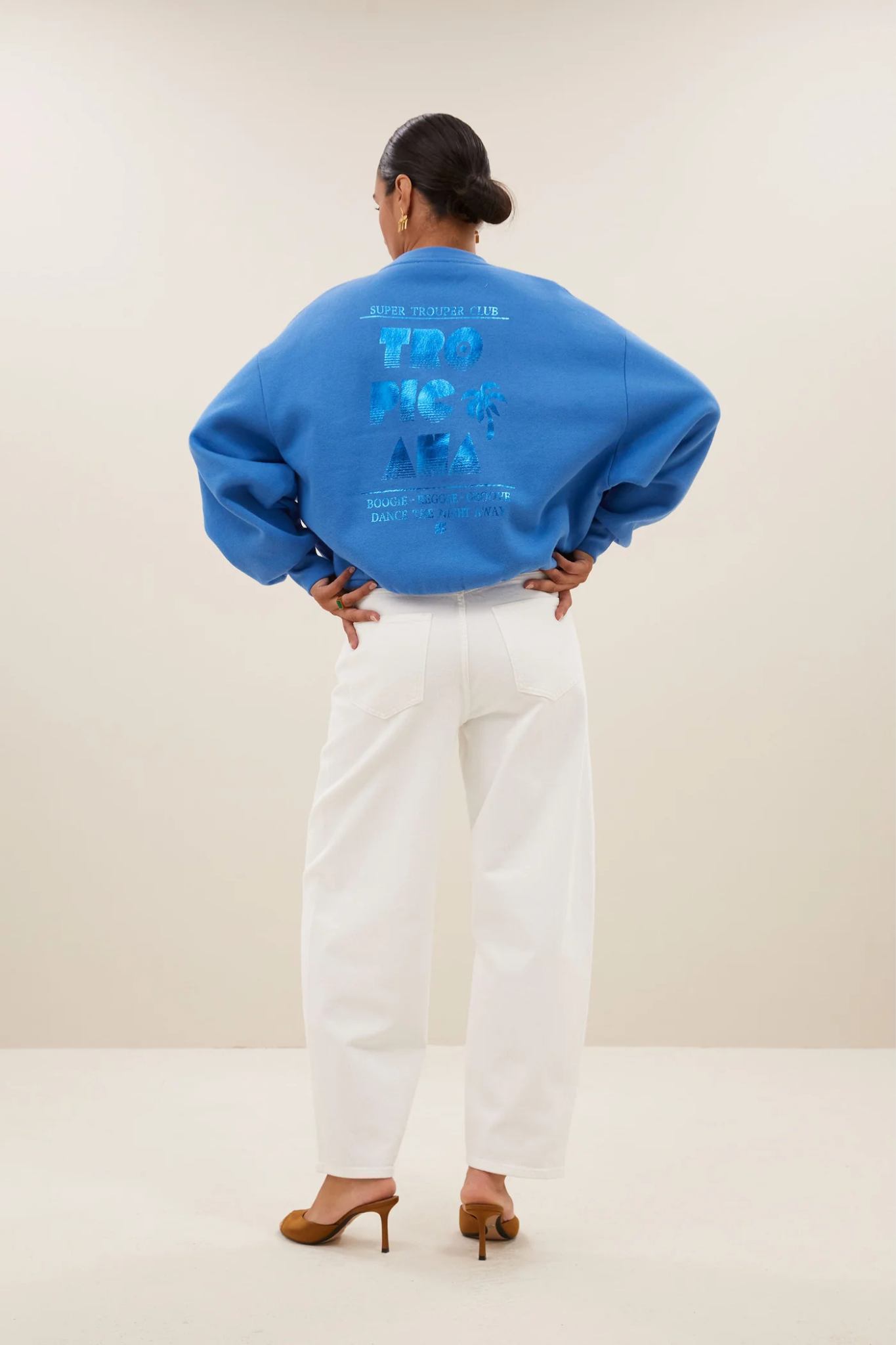 Model wearing the By-Bar bibi dancing sweater in queens blue. Back view