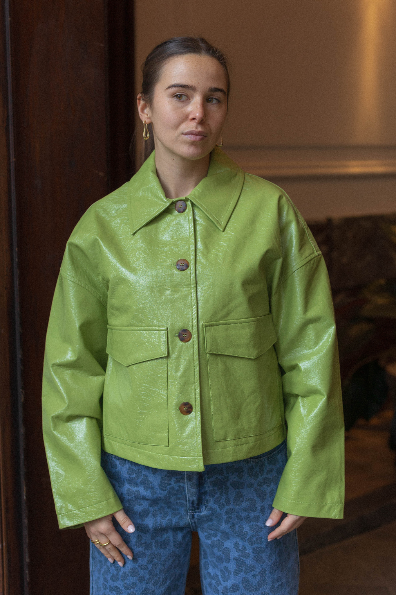 Model wearing the FRNCH carmelie jacket in green. Front view